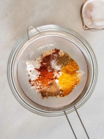 sifting the dry ingredients using a wire colander.