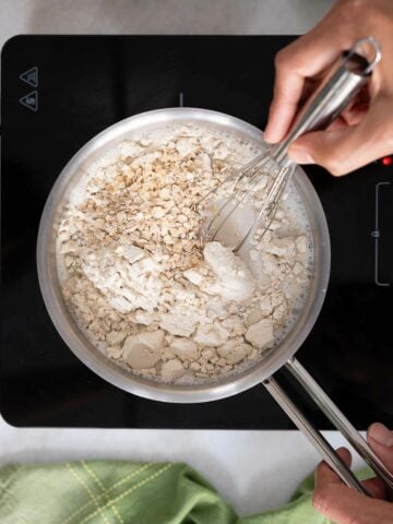 stir in oatmeal and whisk to dissolve clumps.