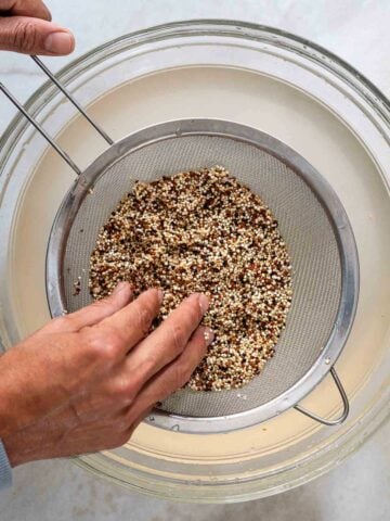 washing and rinsing quinoa with a fine-mesh colander.