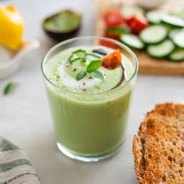 glass with creamy cold cucumber soup.
