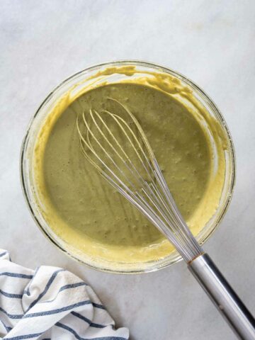 whisk with the mixed matcha batter in a bowl.