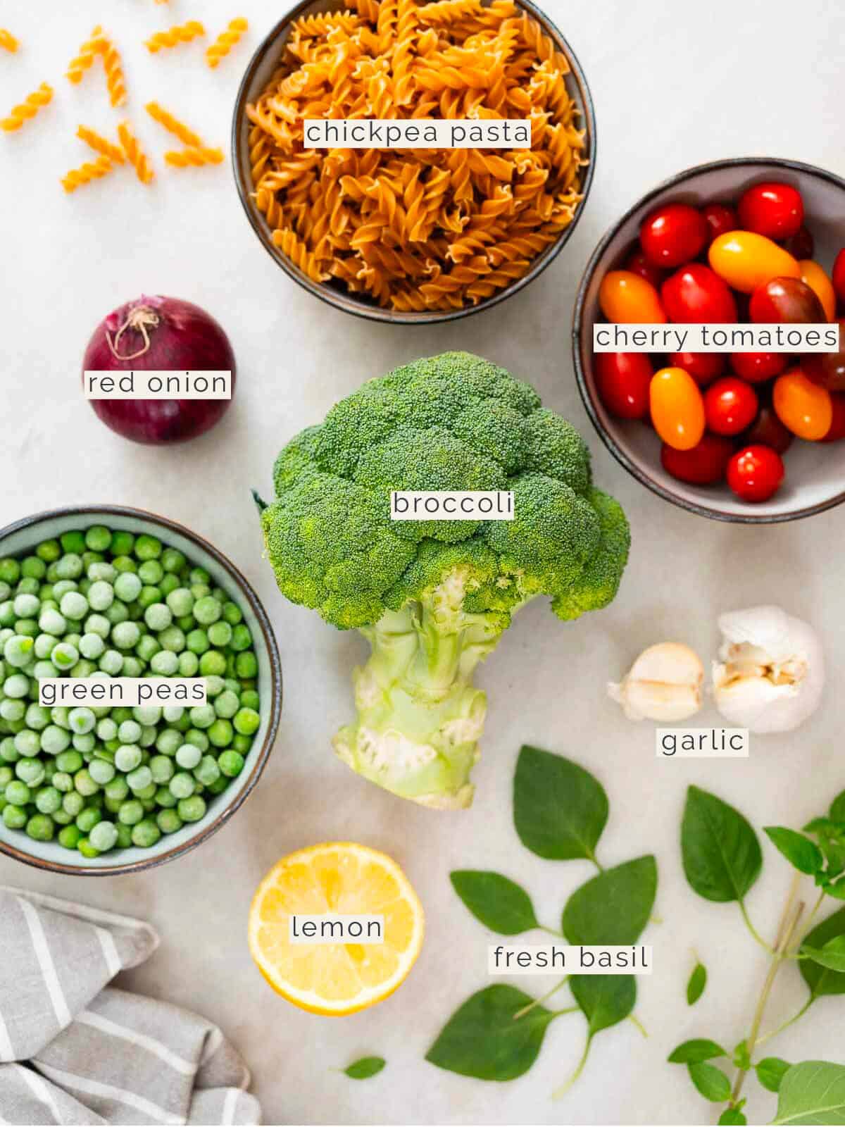 labeled ingredients to make a high-protein healthy pasta salad.