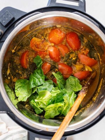 open the instant pot after quick releasing the pressure and adding the rest of spinach.