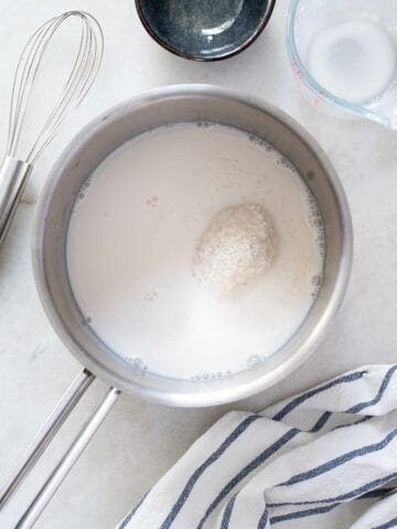 Tapioca Starch and Almond Milk Mixture in Saucepan - Tapioca starch being diluted in almond milk in a saucepan.