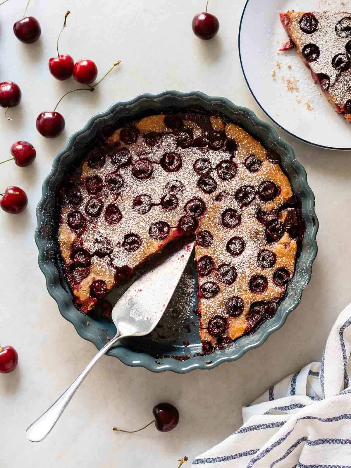 Baked Vegan Sherry Pie with a Slice Removed - A fully baked pie with a slice removed, showing the cherry filling and golden crust.