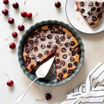 Baked Vegan Sherry Pie with a Slice Removed - A fully baked pie with a slice removed, showing the cherry filling and golden crust.