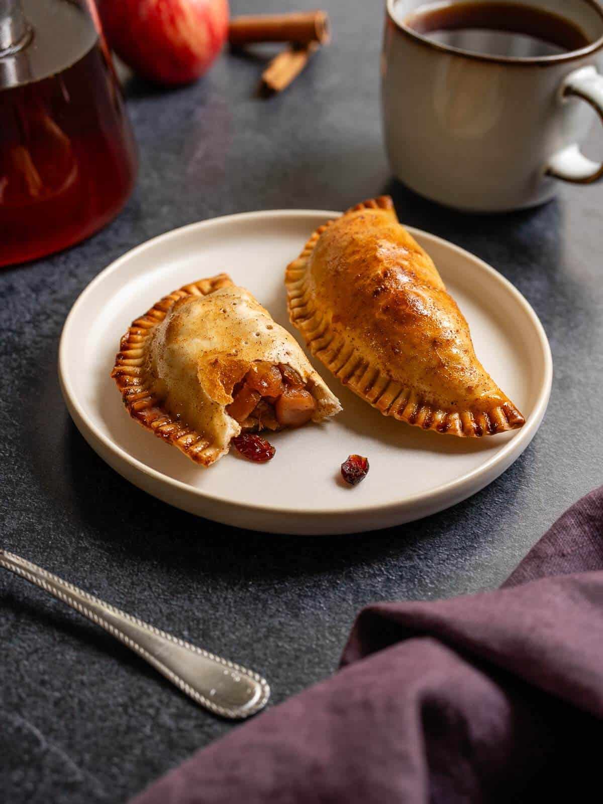 apple empanadas exposing the inner filling.