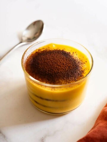 chocolate pumpkin cake portion on a dessert glass cup.