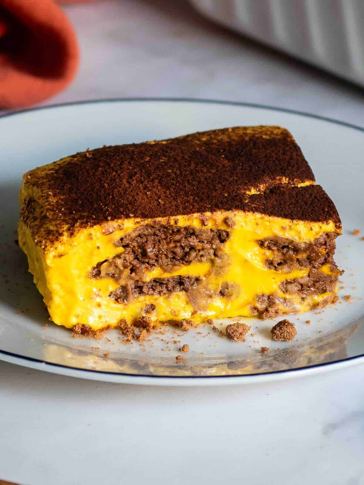 chocolate pumpkin cake portion on a serving plate.