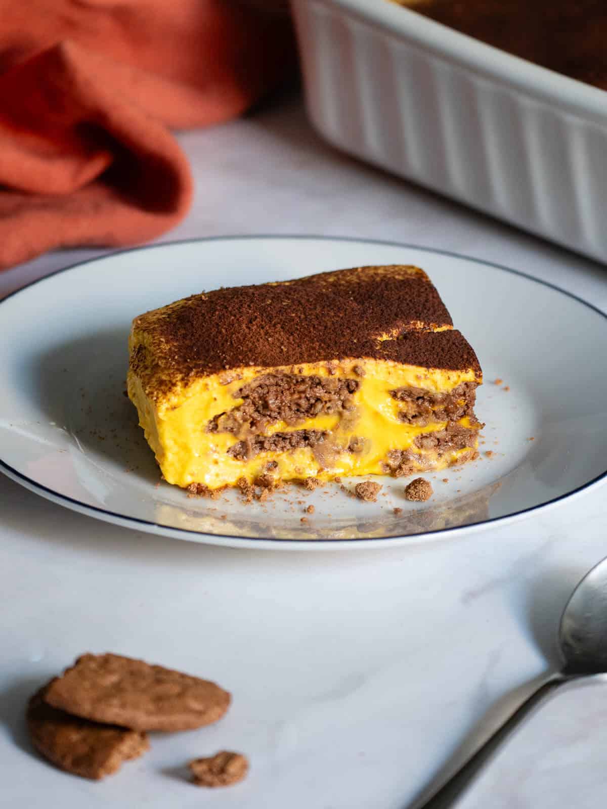 chocolate pumpkin cake portion on a serving plate.