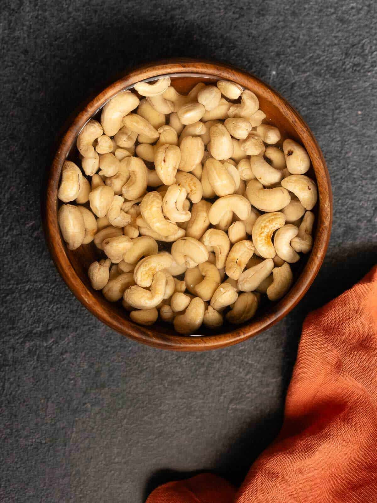 soaking cashews in a bowl.