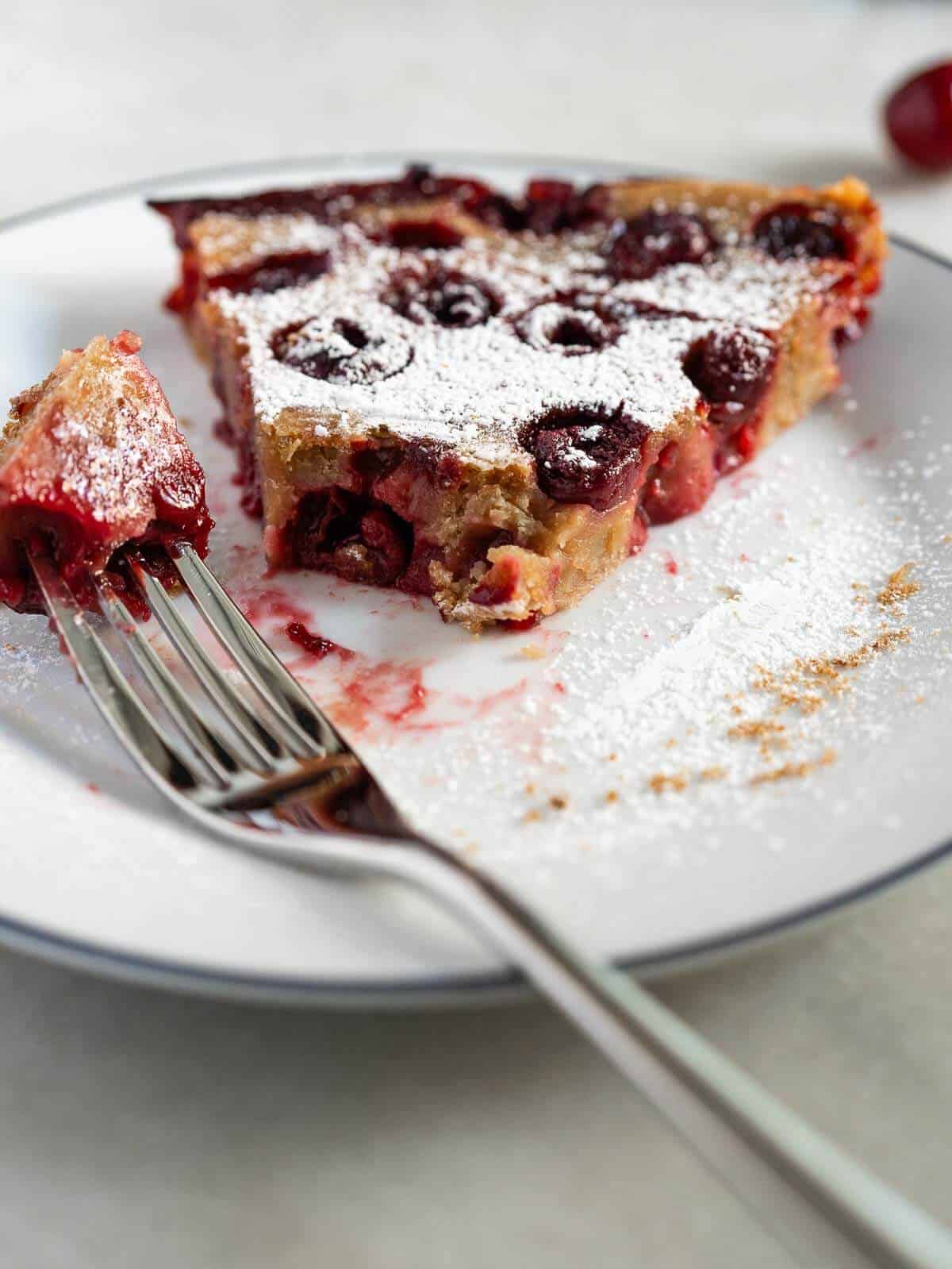 vegan cherry pie served with a fork