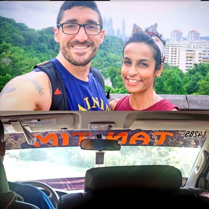 mitri and natasha selfie with a signage on van showing their first initials 