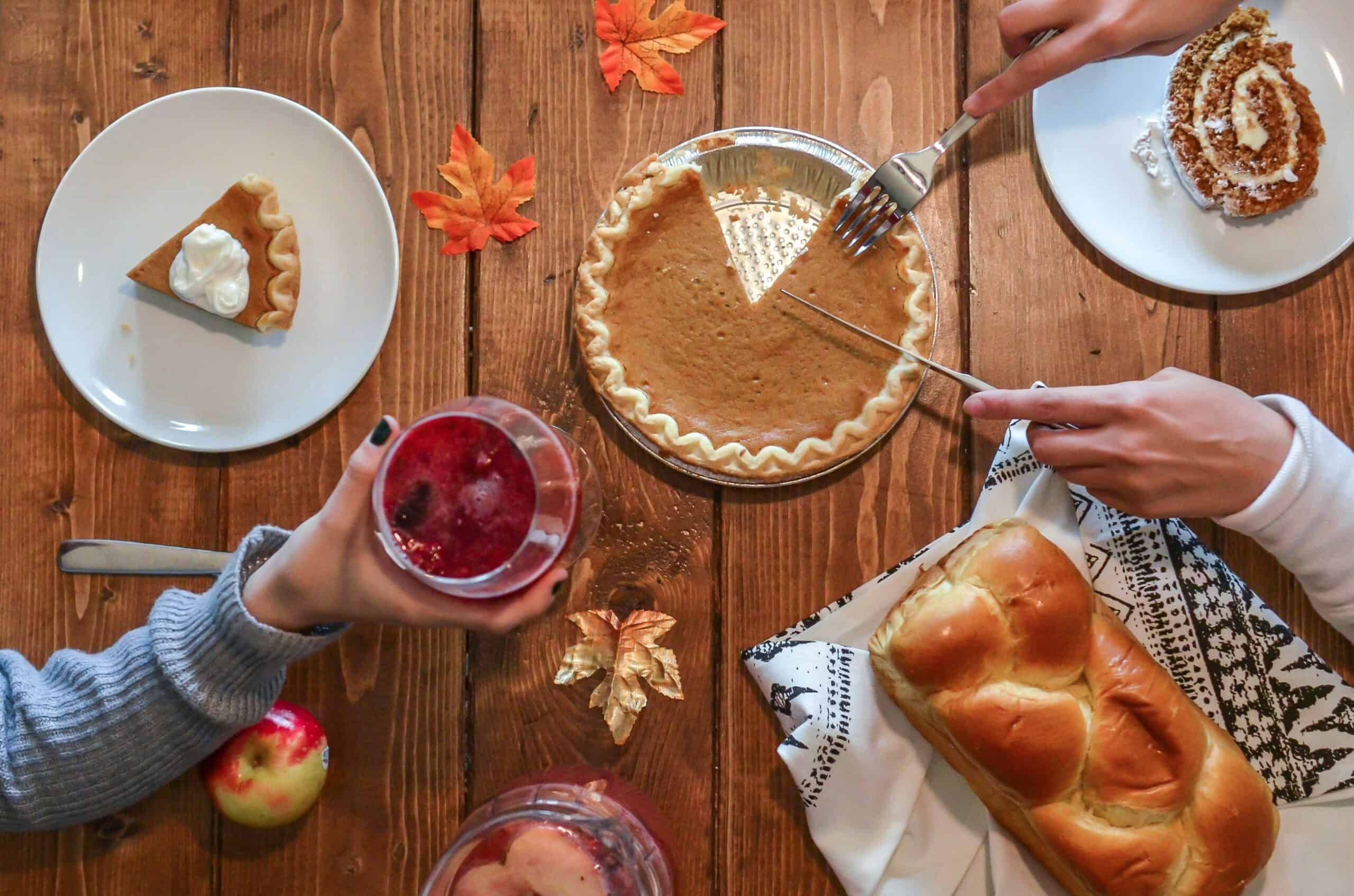 Thanksgiving table setting with fresh bread rolls and 